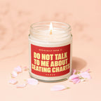 Lit candle in a jar with a red label reading "Do Not Talk to Me About Seating Charts."