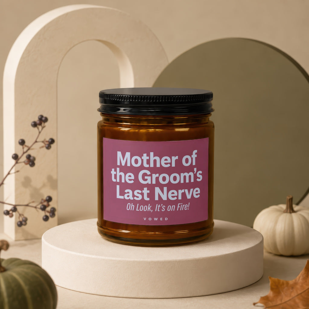 Amber candle with pink label reading "Mother of the Groom's Last Nerve Oh Look, It's on Fire!".