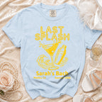 Light blue t-shirt with "LAST SPLASH" graphic and "Sarah's Bach" details.