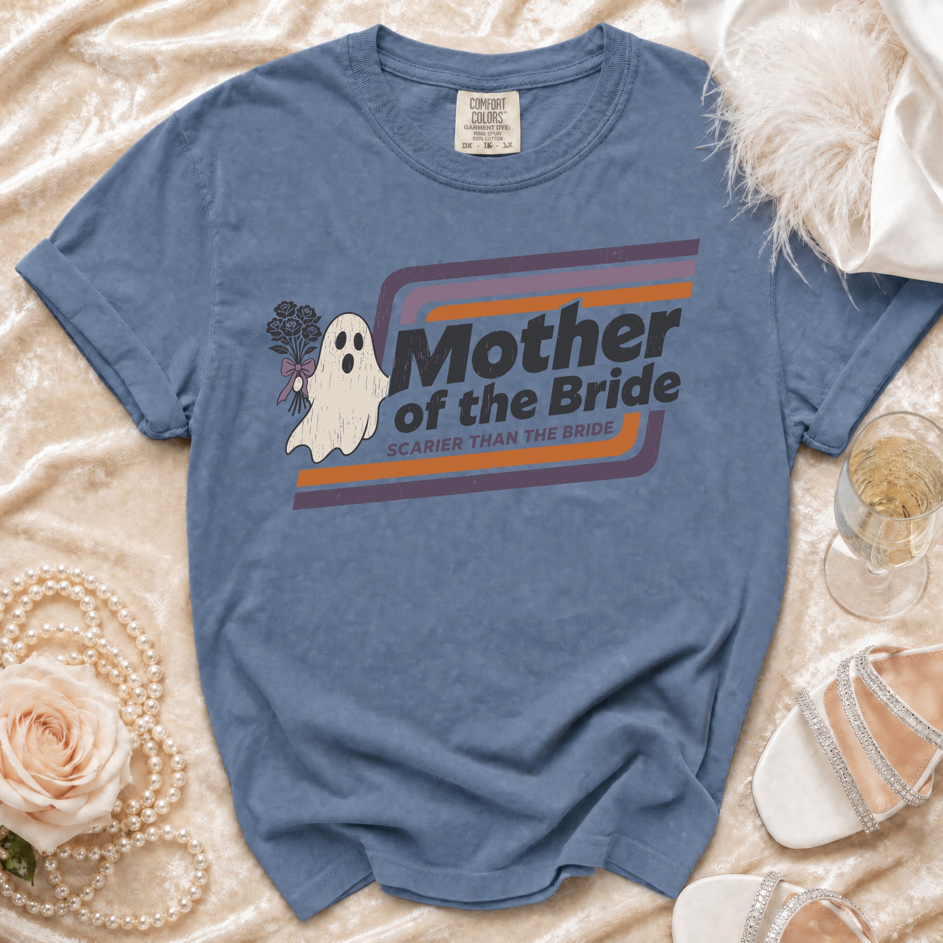 Blue t-shirt with "Mother of the Bride Scarier Than the Bride" text and a ghost graphic.