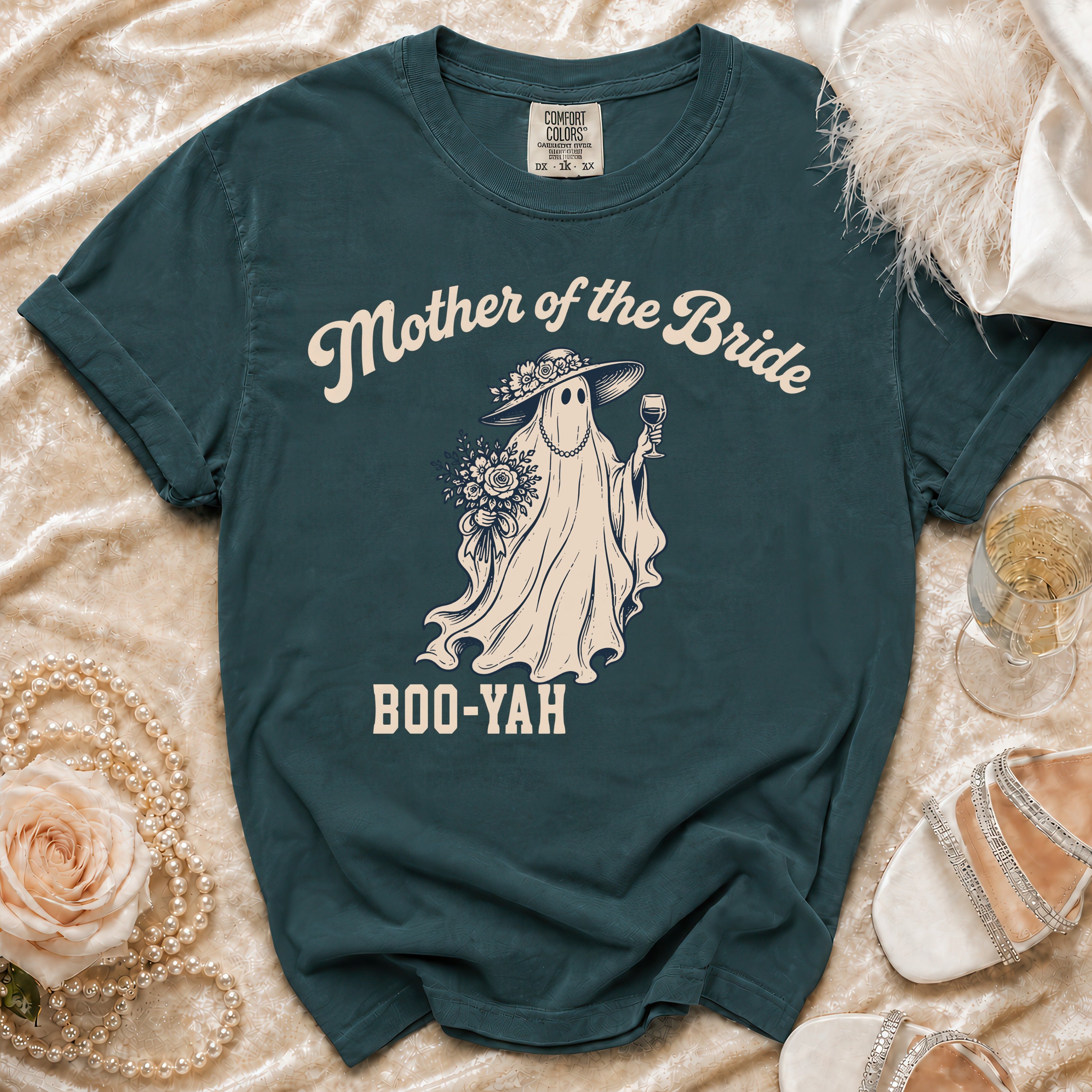Teal t-shirt with a ghost graphic saying "Mother of the Bride BOO-YAH".