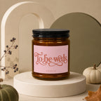 Brown glass candle with pink label reading "To-be-weds VOWED".
