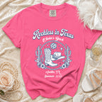 Pink t-shirt with "Reckless in Texas Olivia's Bach Austin, TX Summer 2026" text.