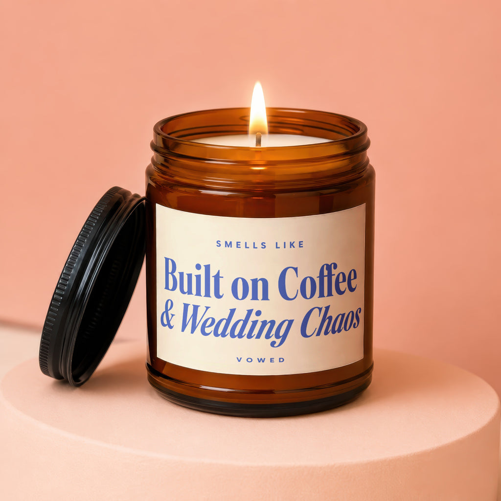 Lit amber glass candle with "Built on Coffee & Wedding Chaos" text.
