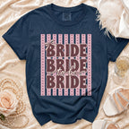 Navy t-shirt with "Bride to Be Bride" text and decorative bow.
