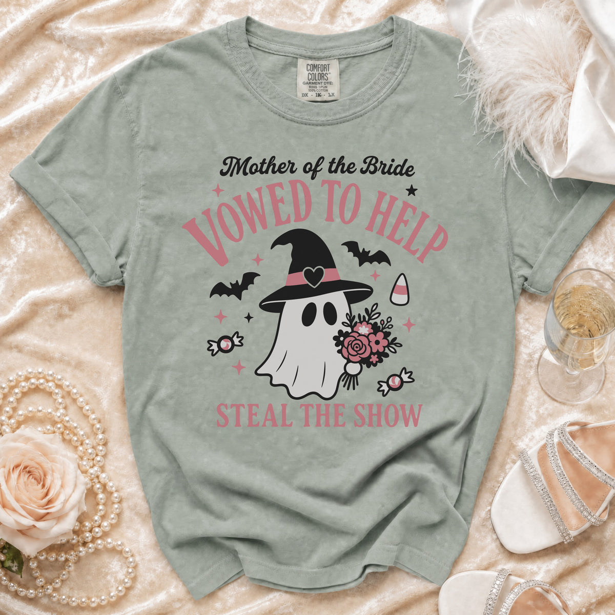 Green t-shirt with "Mother of the Bride Vowed to Help Steal the Show" graphic.