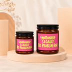 Two amber jars with black lids, pink labels read "Emotionally Legally His Problem Now".