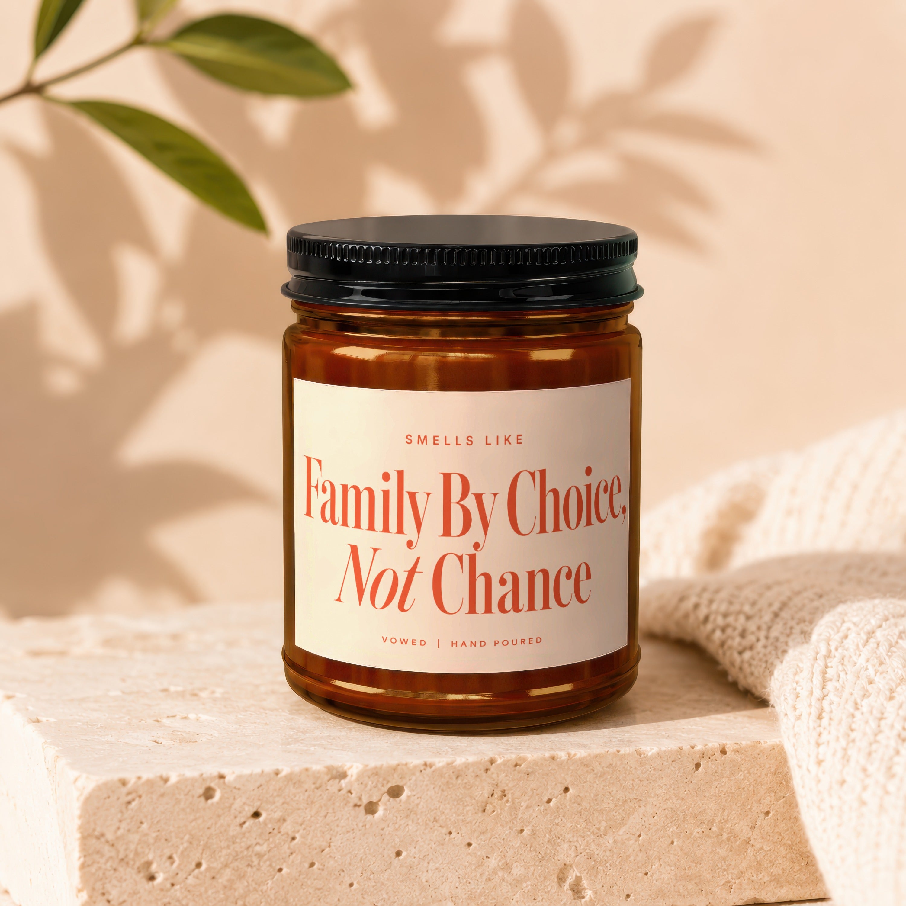 Candle with label "Smells Like Family By Choice, Not Chance. Vowed | Hand Poured."