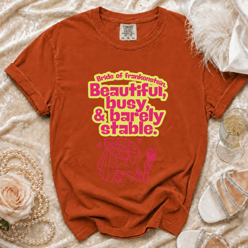 Orange t-shirt with "Bride of Frankenstein, Beautiful, busy, & barely stable." text.