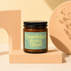 Brown candle with black lid, label reads "Commitment Looks Good"