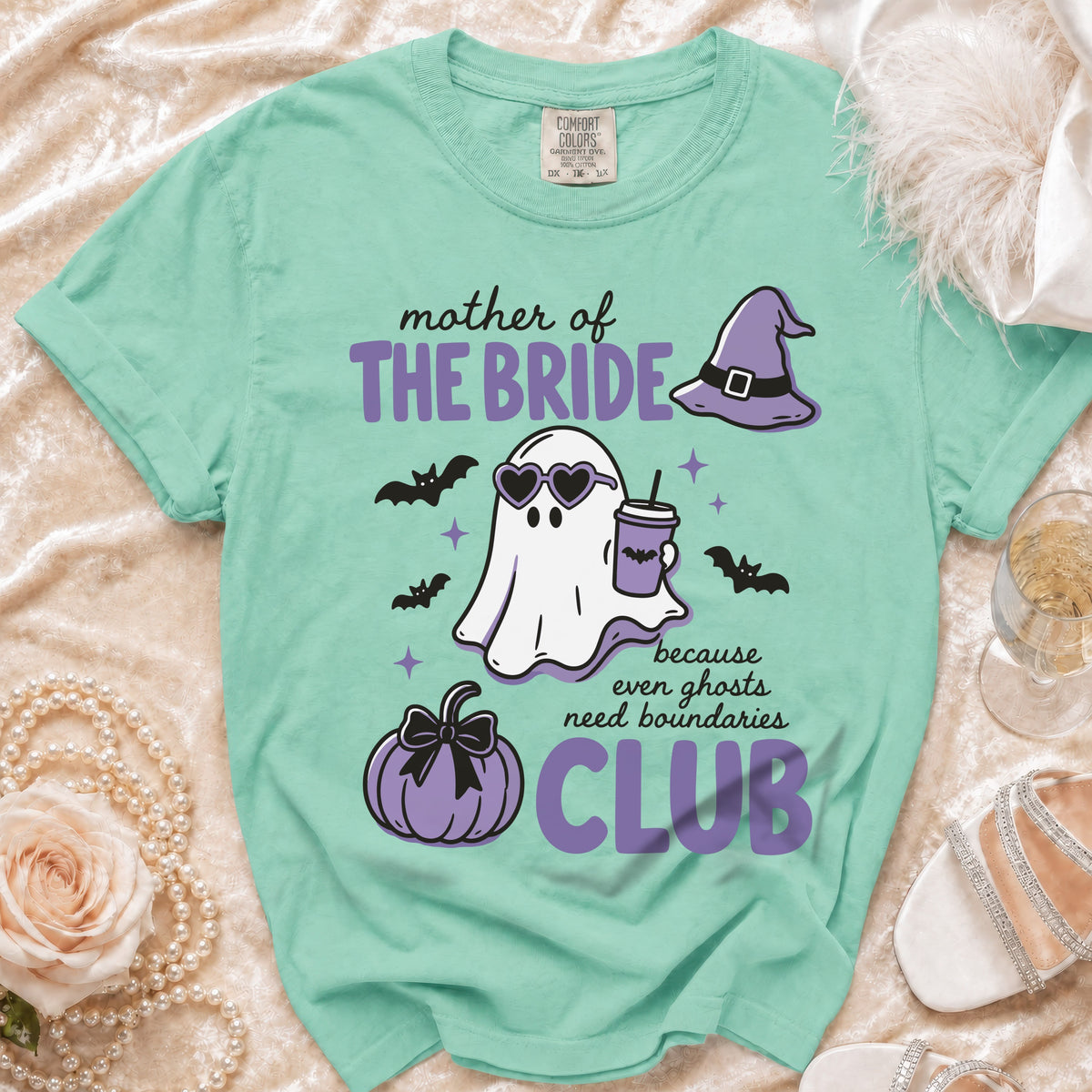 Mint green t-shirt with "Mother of The Bride Club" text, ghost, pumpkin, and bats.