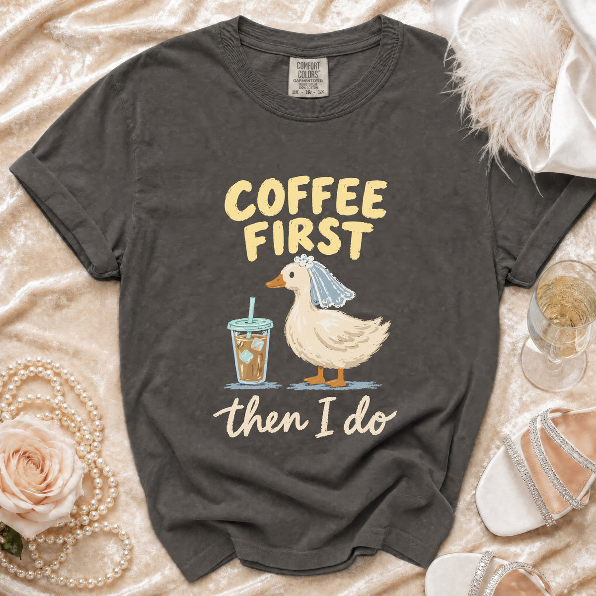 T-shirt with a duck wearing a veil, holding coffee, and text "Coffee First then I Do".