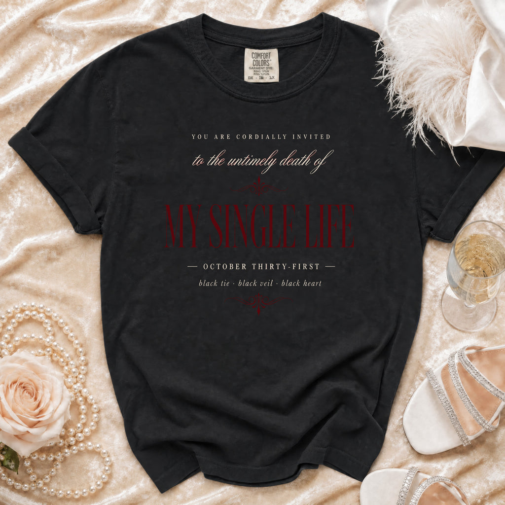 Black t-shirt with text "My Single Life" and "October Thirty-First" on velvet.