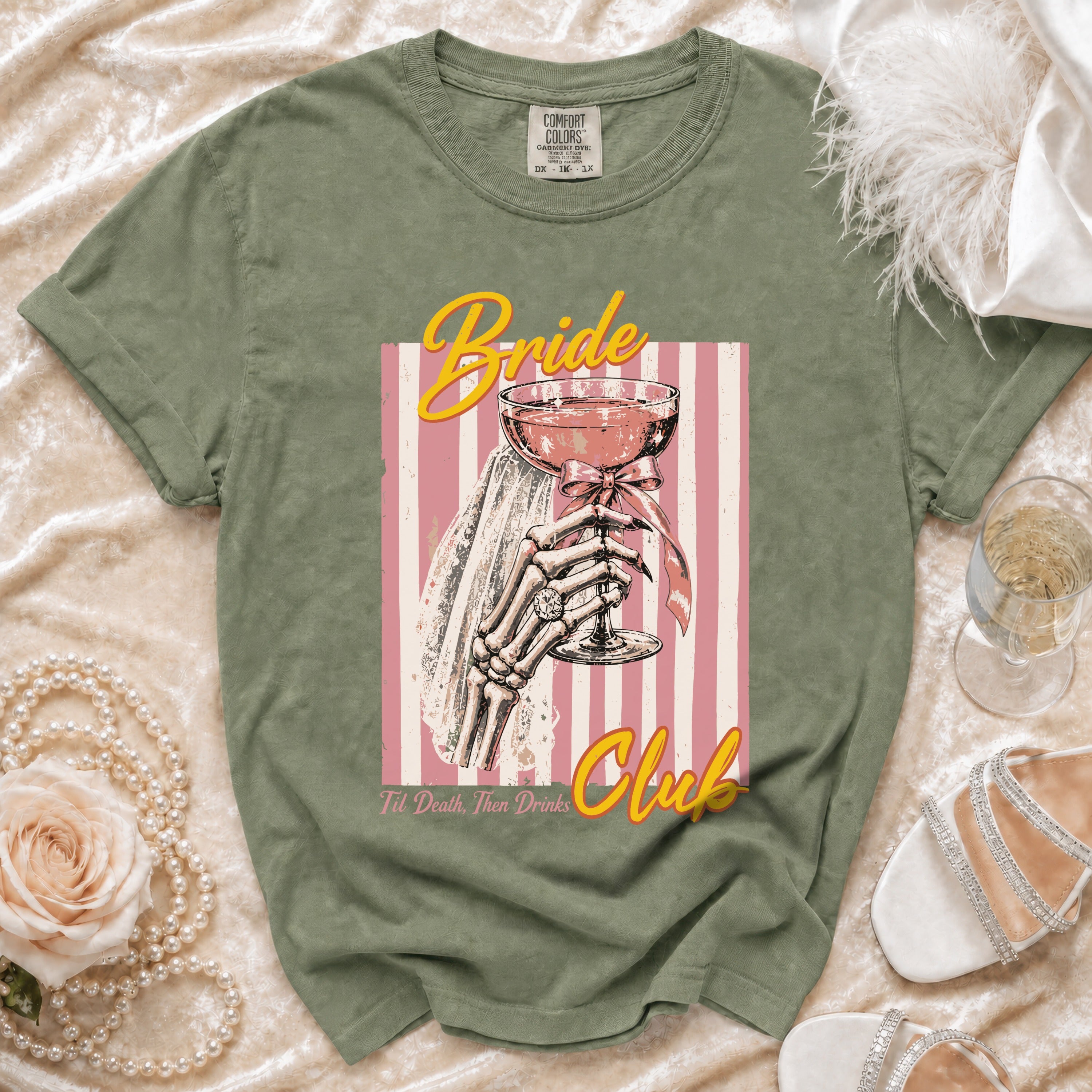 Green t-shirt with skeleton hand holding "Bride" cocktail and text "Til Death, Then Drinks".