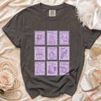 Dark gray t-shirt with purple stamp-like graphics of skeletons, ghosts, and wedding themes.