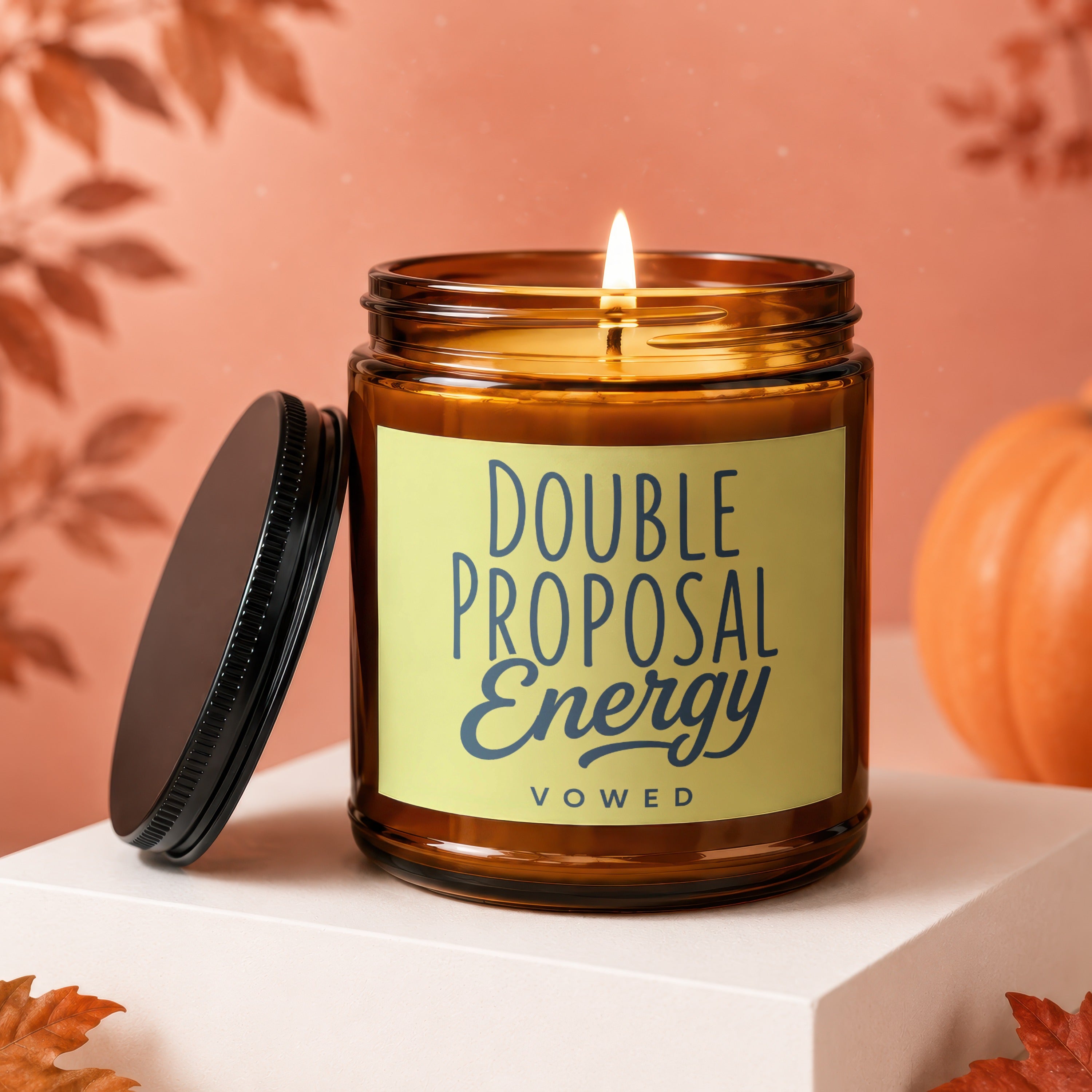 Candle with text "DOUBLE PROPOSAL Energy BOWED" on a light yellow label.