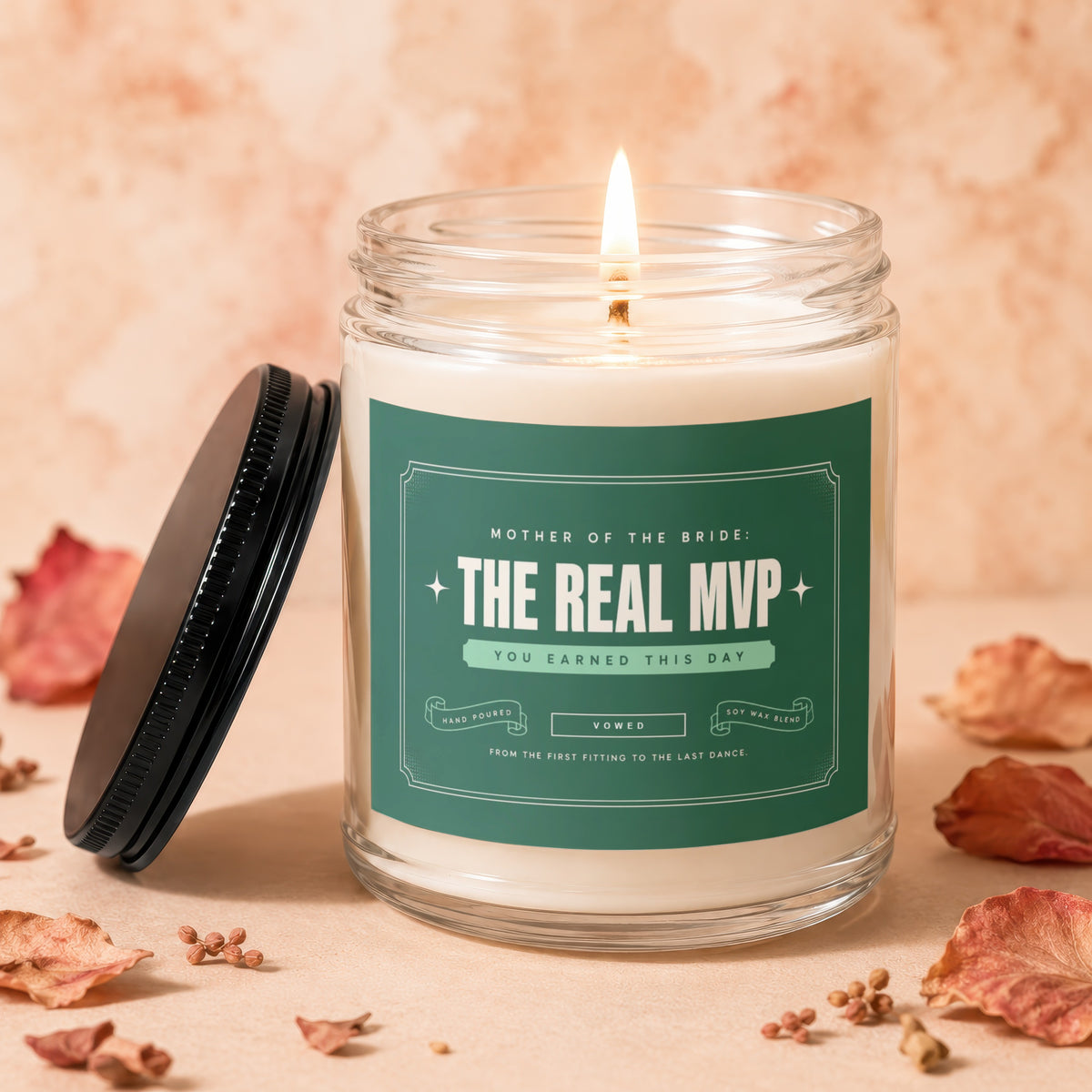 Candle for Mother of the Bride: "The Real MVP," with lit wick and lid.