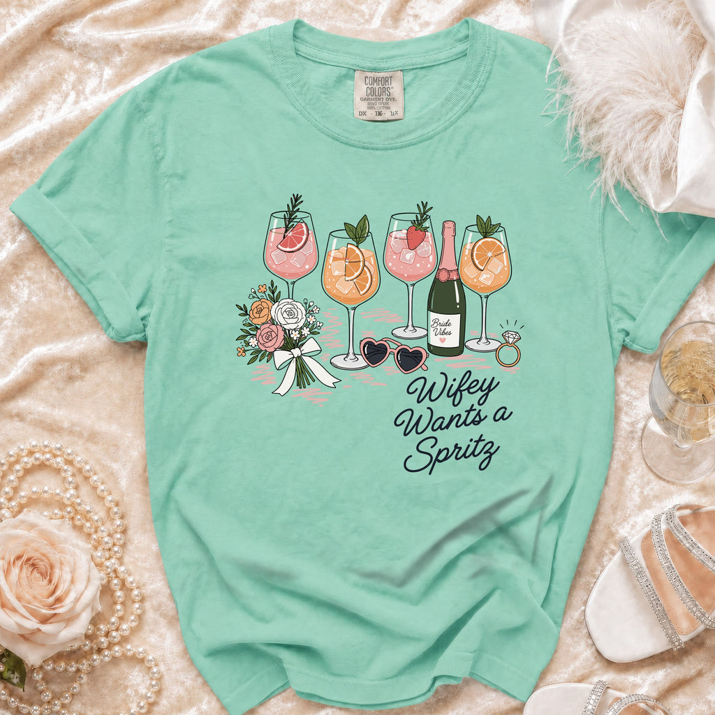 Aqua t-shirt with "Wifey Wants a Spritz" graphic featuring drinks and flowers.