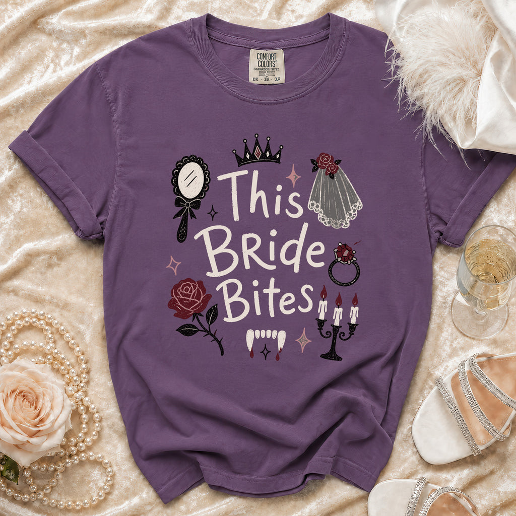 Purple t-shirt with "This Bride Bites" text and vampire graphics.