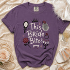 Purple t-shirt with "This Bride Bites" text and vampire graphics.