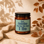 Brown candle with "The Day We Said I Do" text on a light blue label.