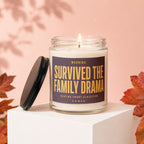 Glass candle with "WARNING: SURVIVED THE FAMILY DRAMA" text, lid off.