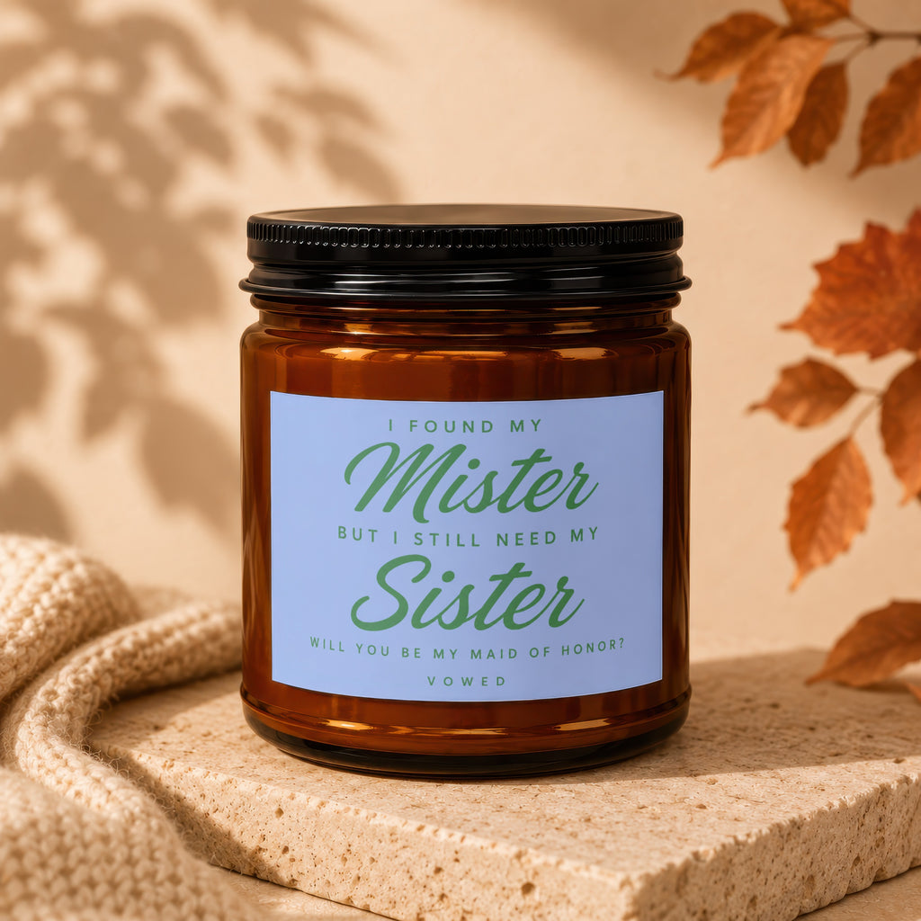 Amber candle jar with "I found my Mister but I still need my Sister" text.