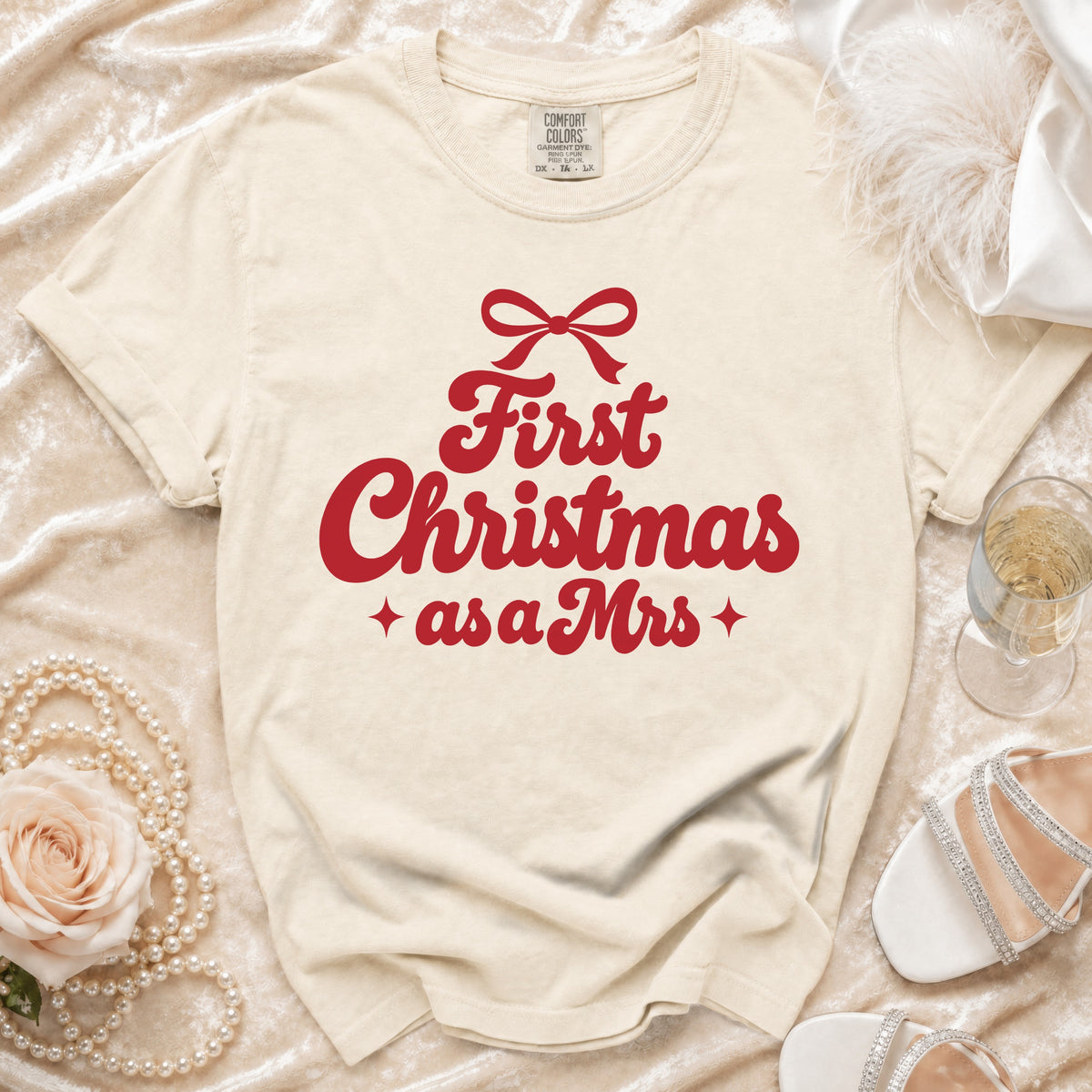 Cream t-shirt with red text "First Christmas as a Mrs" and a bow.