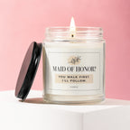 Lit jar candle with "Maid of Honor? You walk first. I'll follow." text.
