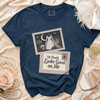Navy t-shirt with "Til Death Looks Good on Me" graphic and wedding dress imagery.