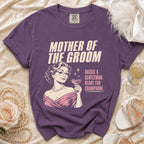 Purple t-shirt with "Mother of the Groom Raised a Gentleman. Ready for Champagne." text.