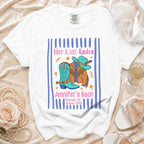 White t-shirt with "Her Last Rodeo Jennifer's Bach" text, cowboy boots, and hat.