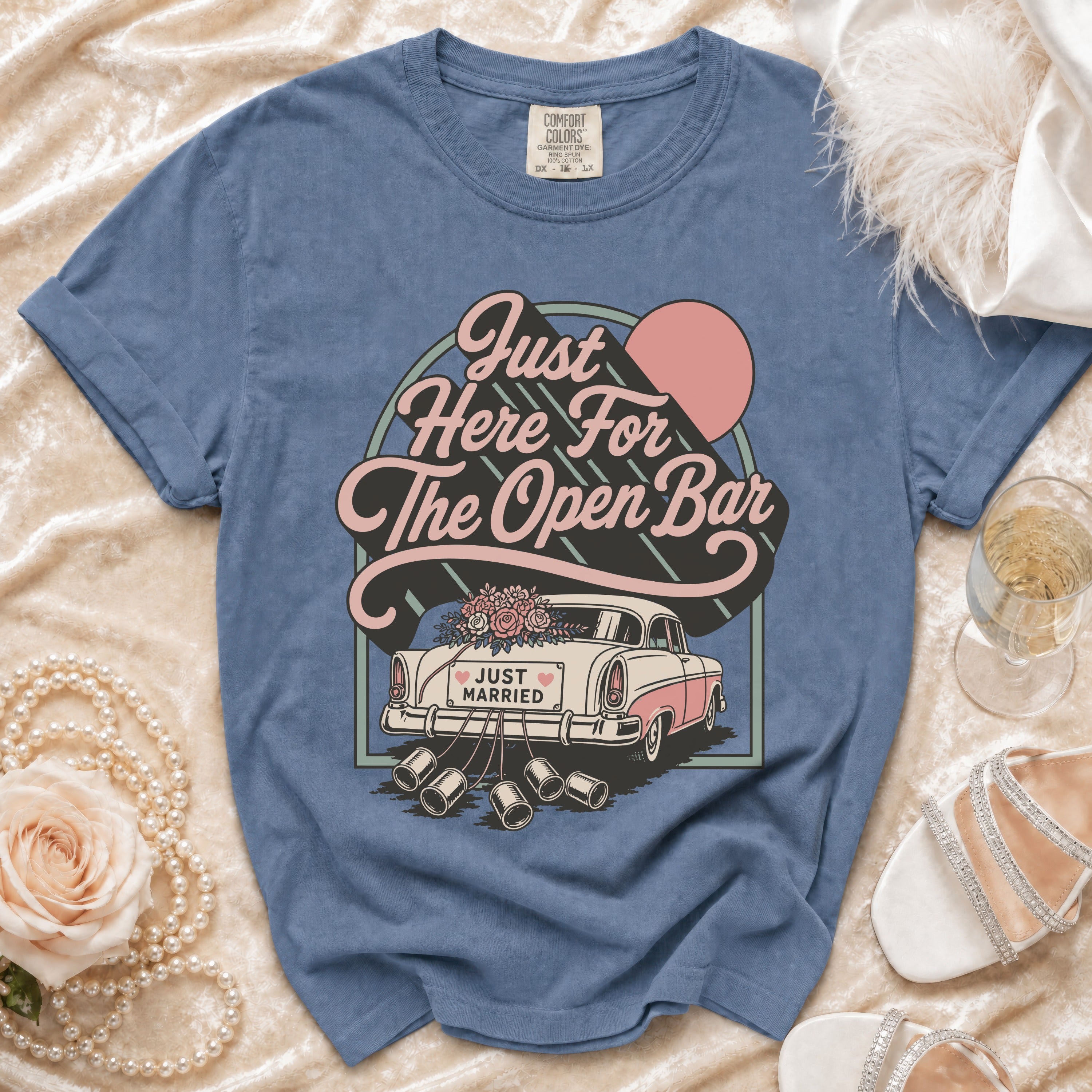 Blue t-shirt with "Just Here For The Open Bar" text and "Just Married" car graphic.