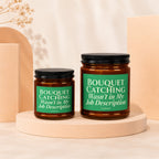 Two glass candles with green labels reading "Bouquet Catching Wasn't in My Job Description."