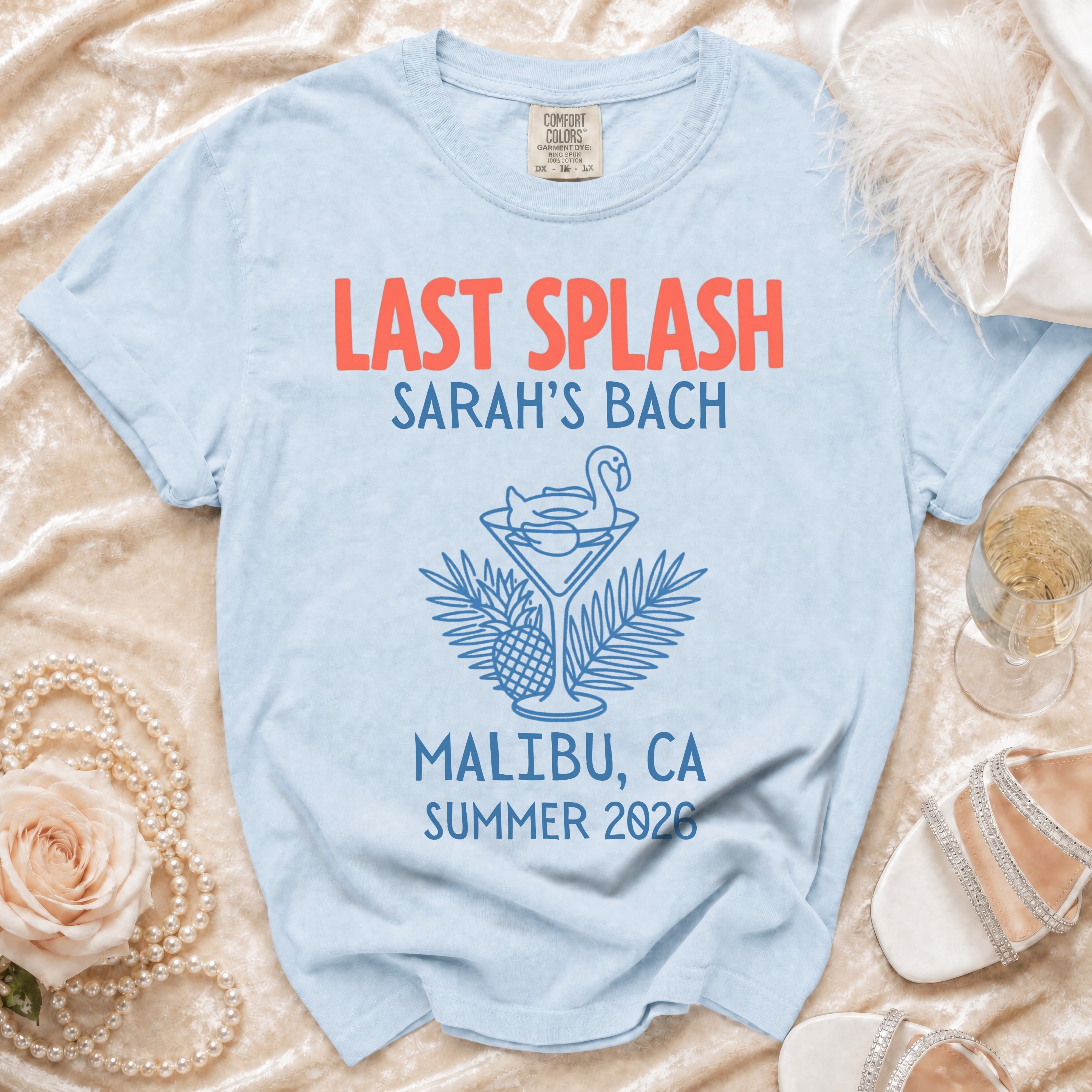 Light blue t-shirt with "Last Splash Sarah's Bach Malibu, CA Summer 2026" text and graphics.