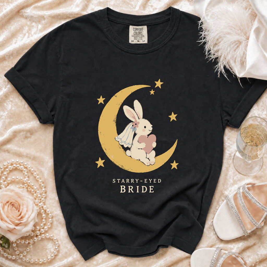 Black t-shirt with a bunny on a moon, stars, and "Starry-Eyed Bride" text.