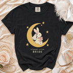 Black t-shirt with a bunny on a moon, stars, and "Starry-Eyed Bride" text.
