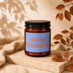 Brown candle with blue label reading "entering bridesmaid era."