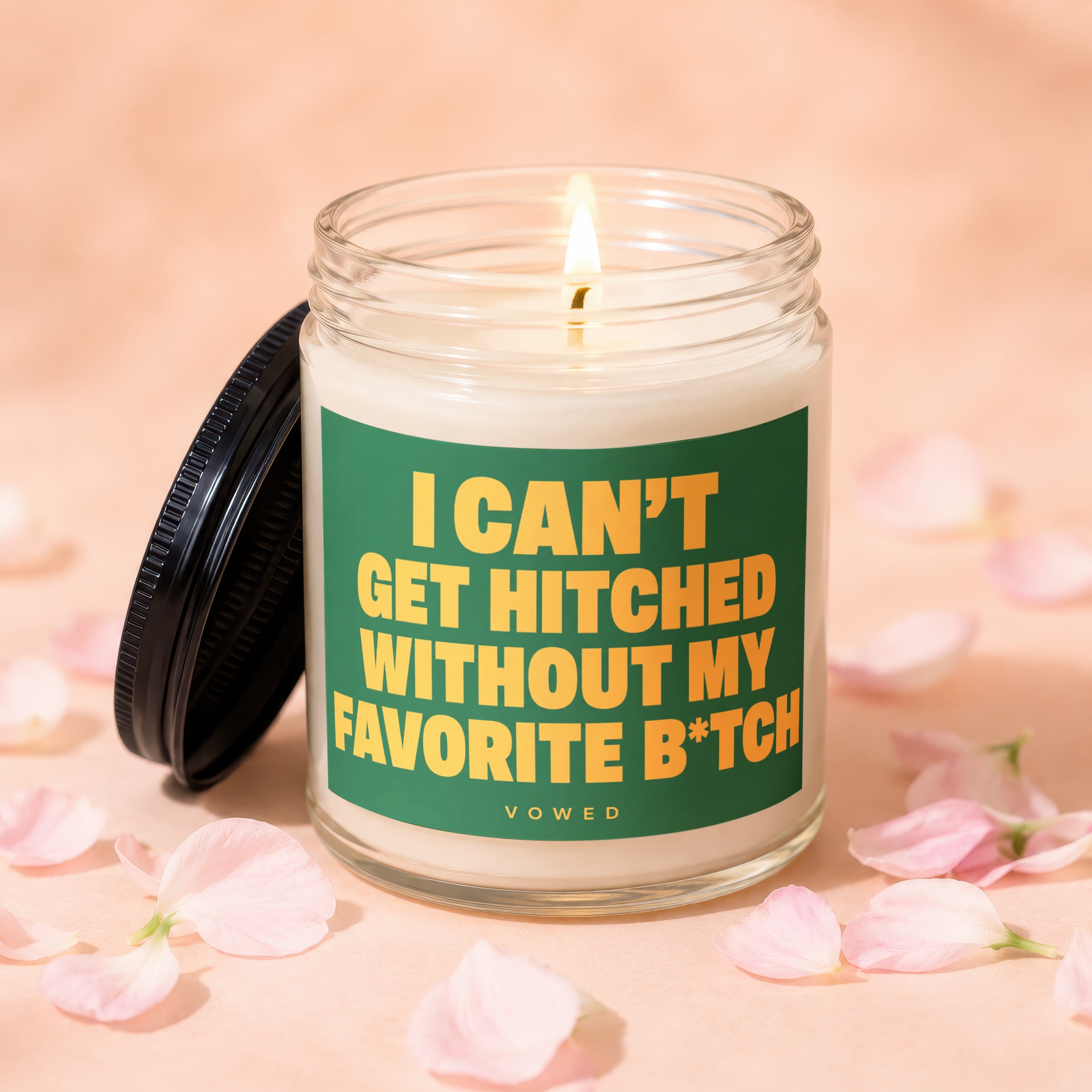 Jar candle with lit wick and lid ajar, reads "I can't get hitched without my favorite b*tch."