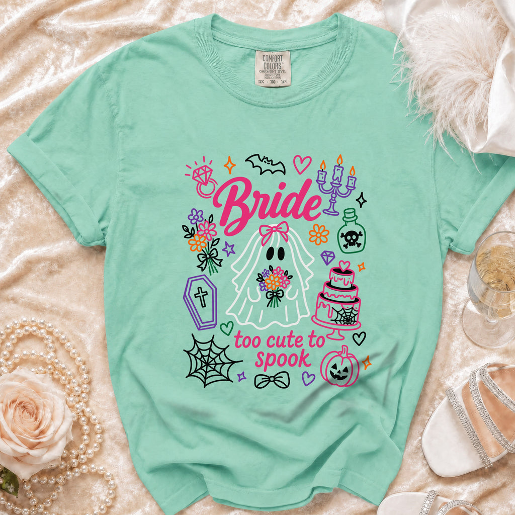 Mint green t-shirt with "Bride" and "too cute to spook" text and Halloween-themed graphics.