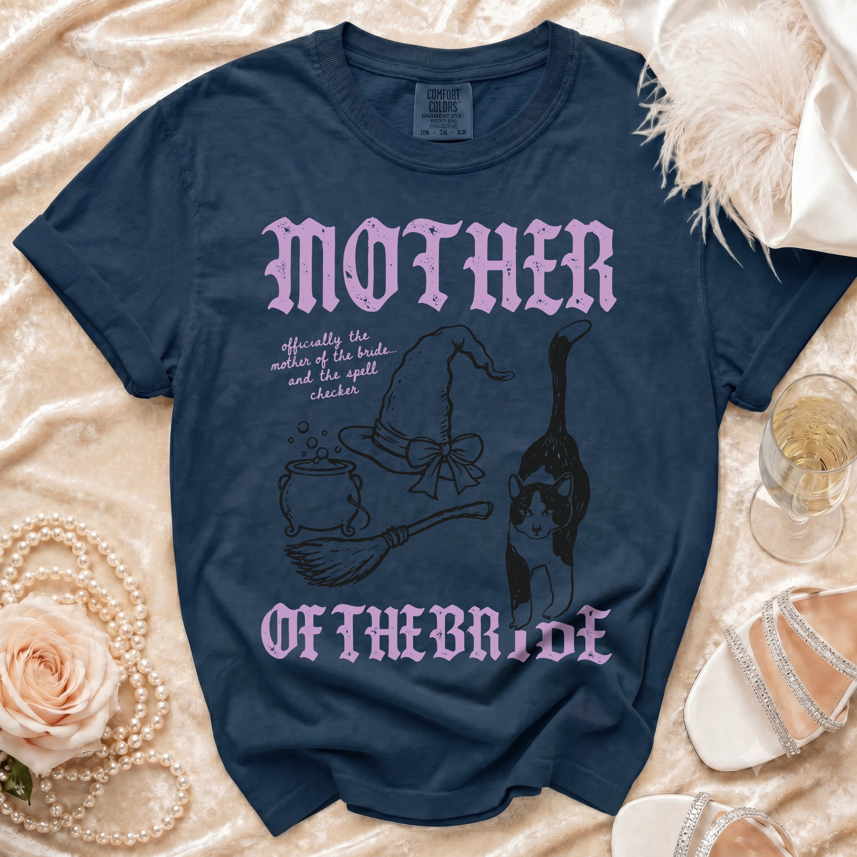 Navy t-shirt with "MOTHER OF THE BRIDE" text and witchy graphics.