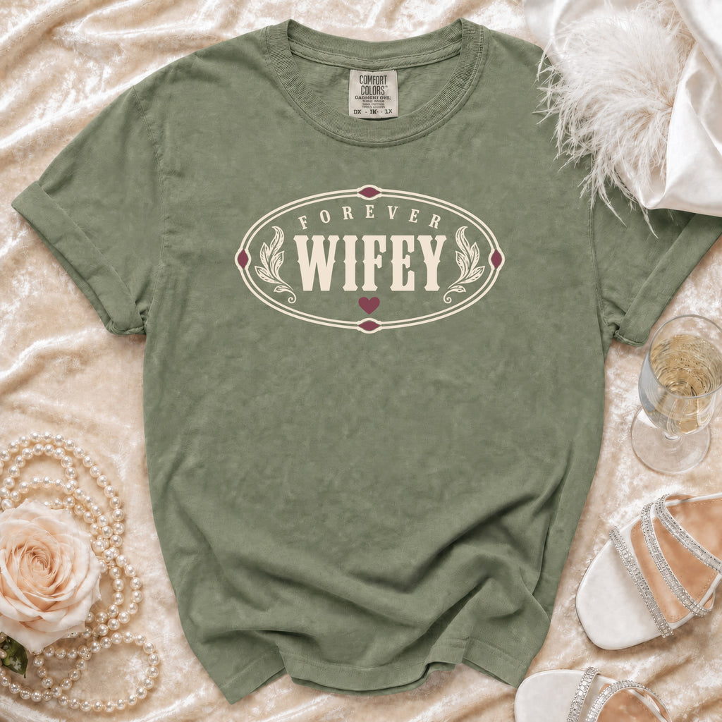 Olive green t-shirt with "Forever Wifey" text in an oval design.