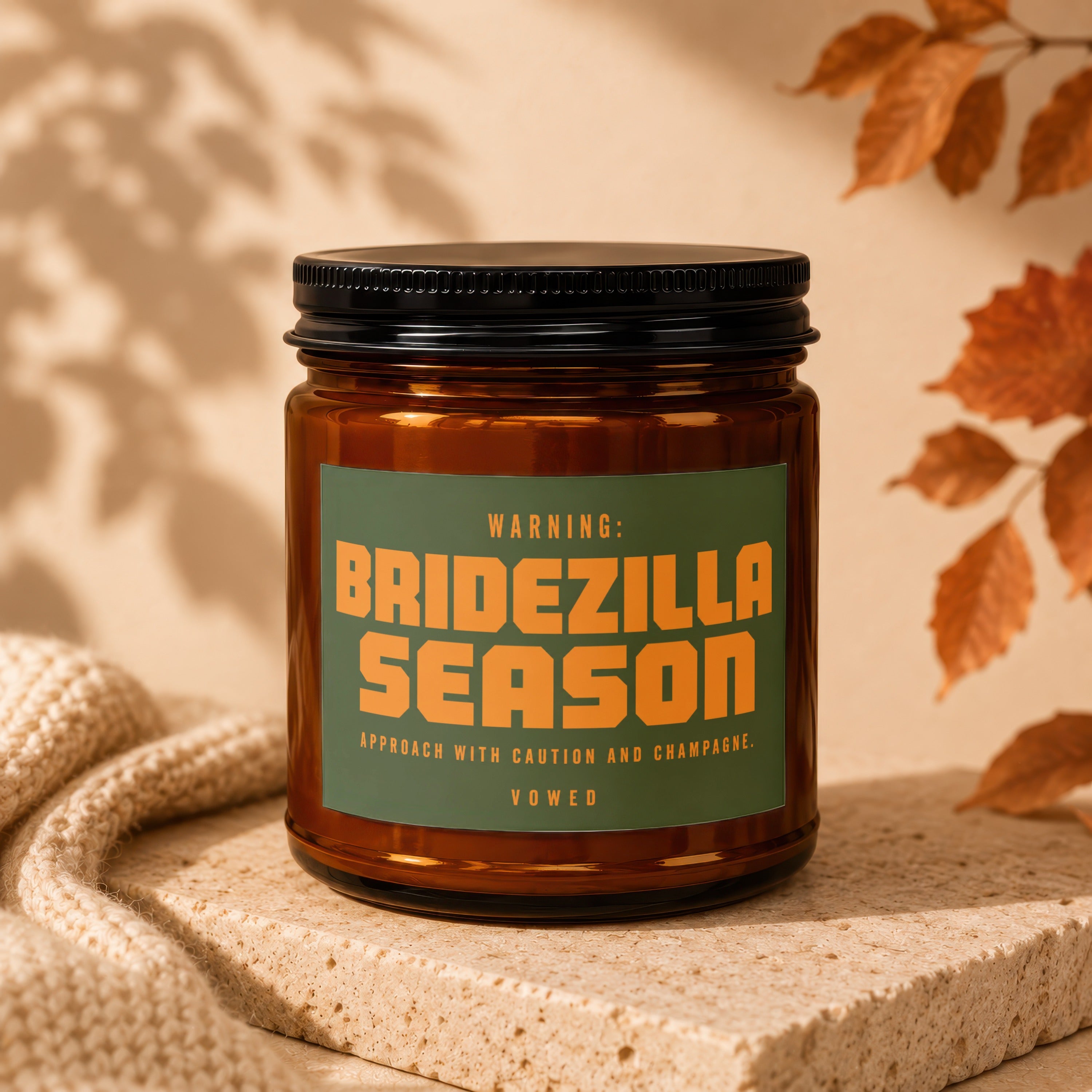 Brown candle labeled "Bridezilla Season" with "Approach with caution and champagne."