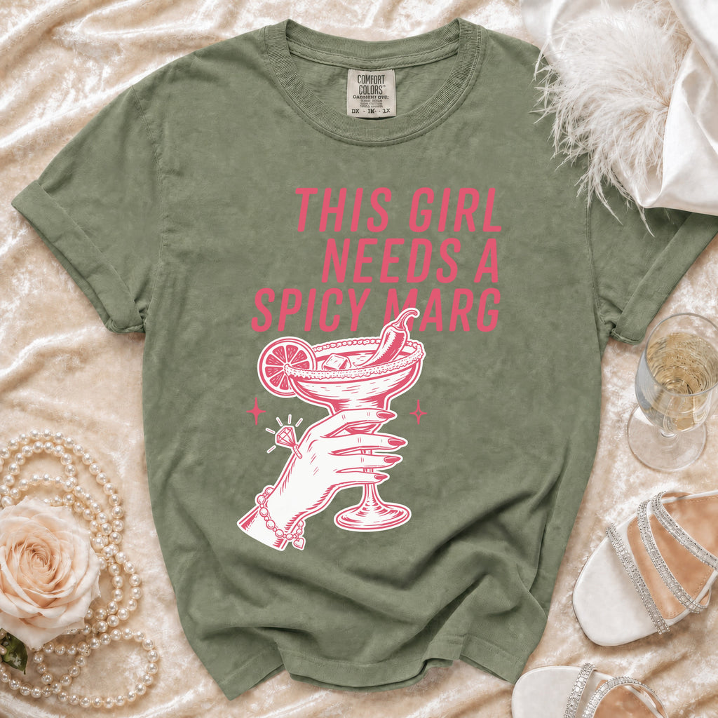 Green t-shirt with graphic "This girl needs a spicy marg" and margarita.
