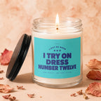 Candle with "Light me when I try on dress number twelve" text.