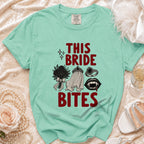 Green t-shirt with "This Bride Bites" text and vampire graphics.
