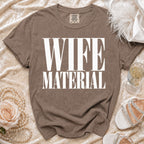 Brown t-shirt with white text that reads "WIFE MATERIAL"
