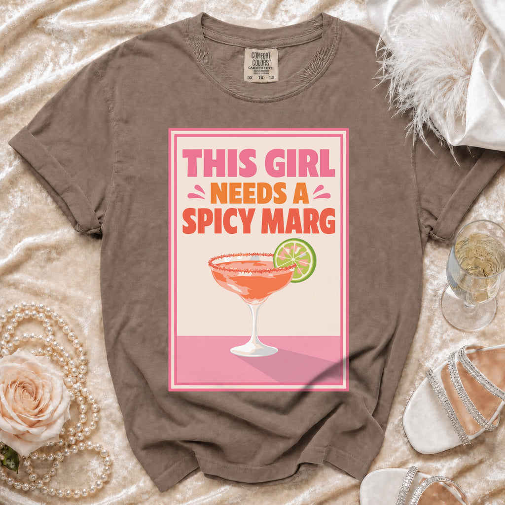 Brown t-shirt with "This girl needs a spicy marg" graphic and margarita.