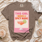 Brown t-shirt with "This girl needs a spicy marg" graphic and margarita.