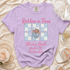 Lavender t-shirt with "Reckless in Texas Olivia's Bach Austin, TX Summer 2026" text.